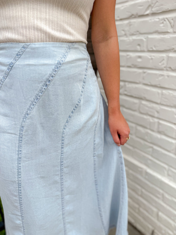 THE SCULPTED DIAGONAL DENIM MIDI SKIRT