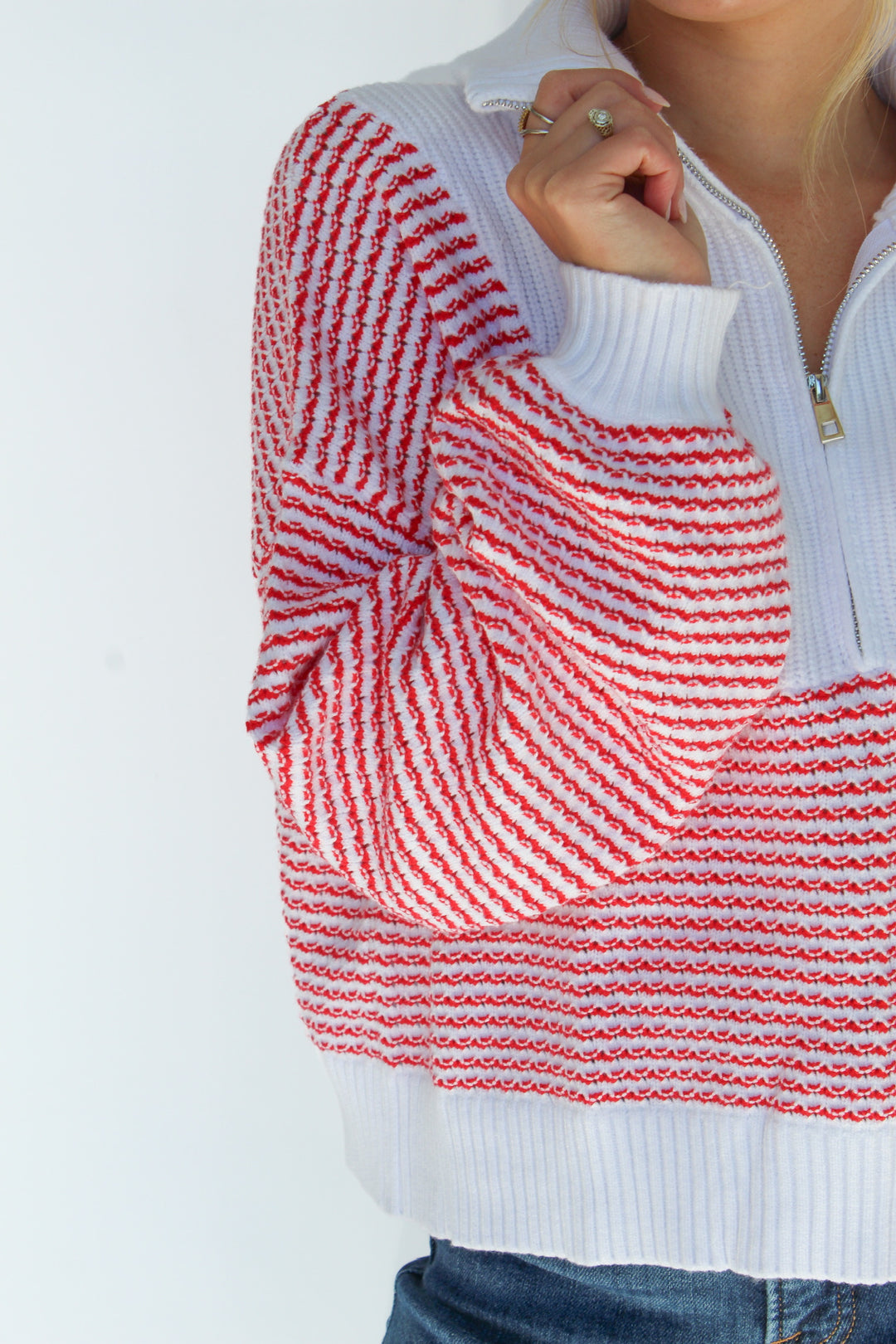 A FINE LINE STRIPED HALF ZIP SWEATER