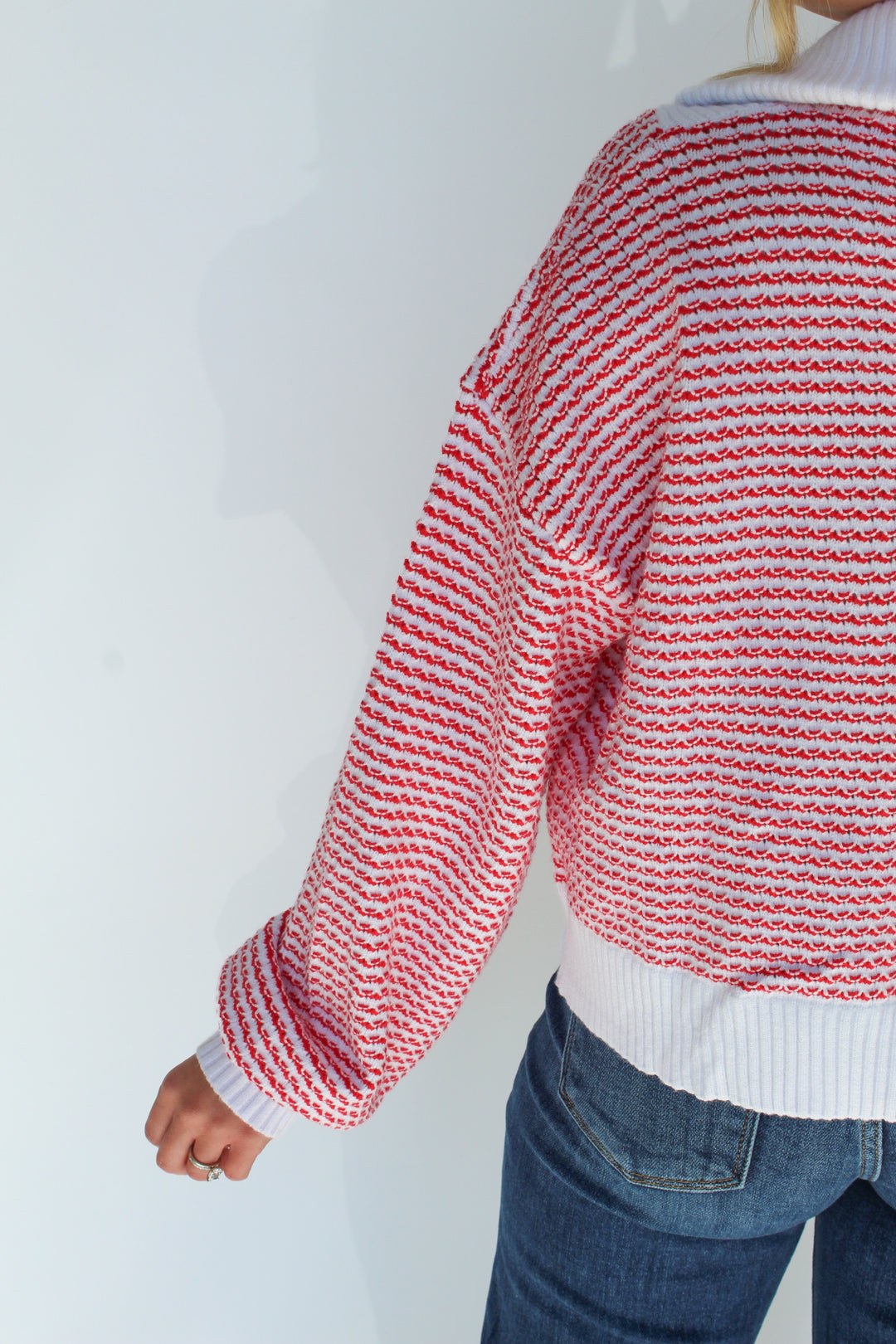 A FINE LINE STRIPED HALF ZIP SWEATER