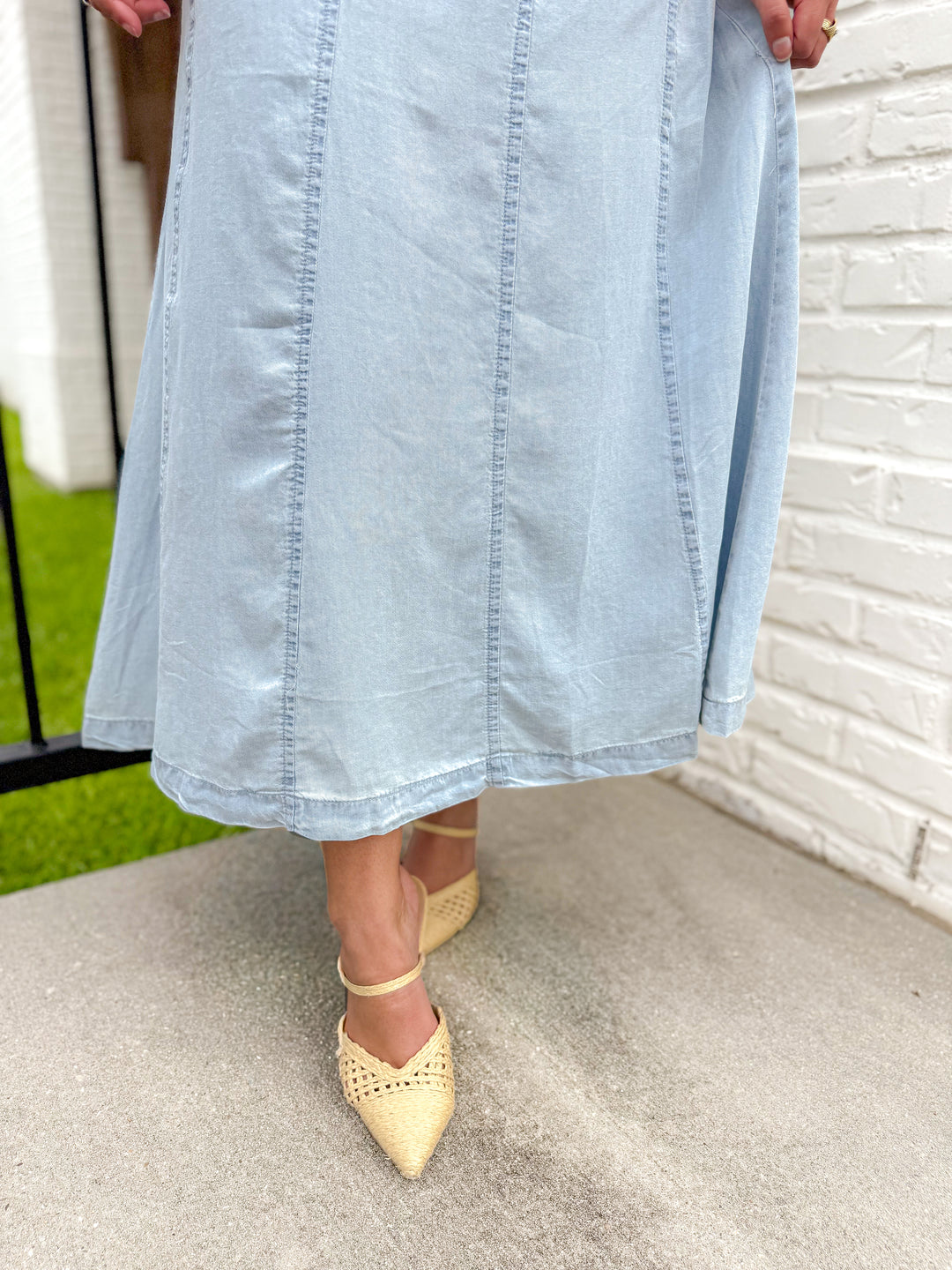 THE SCULPTED DIAGONAL DENIM MIDI SKIRT