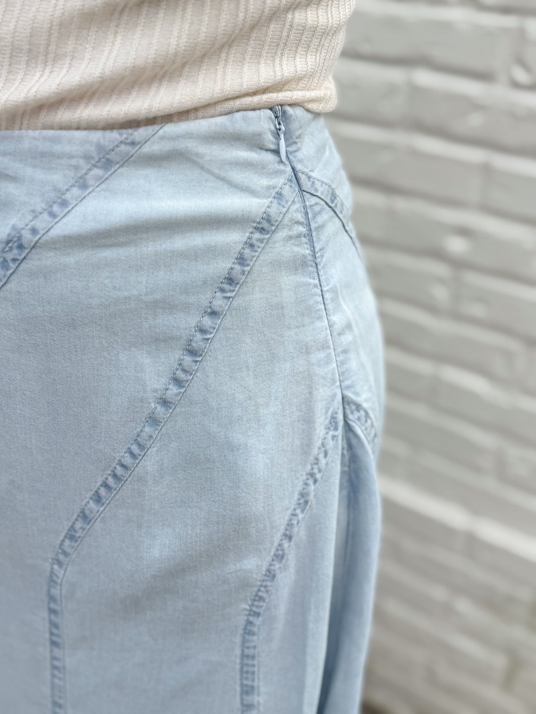 THE SCULPTED DIAGONAL DENIM MIDI SKIRT