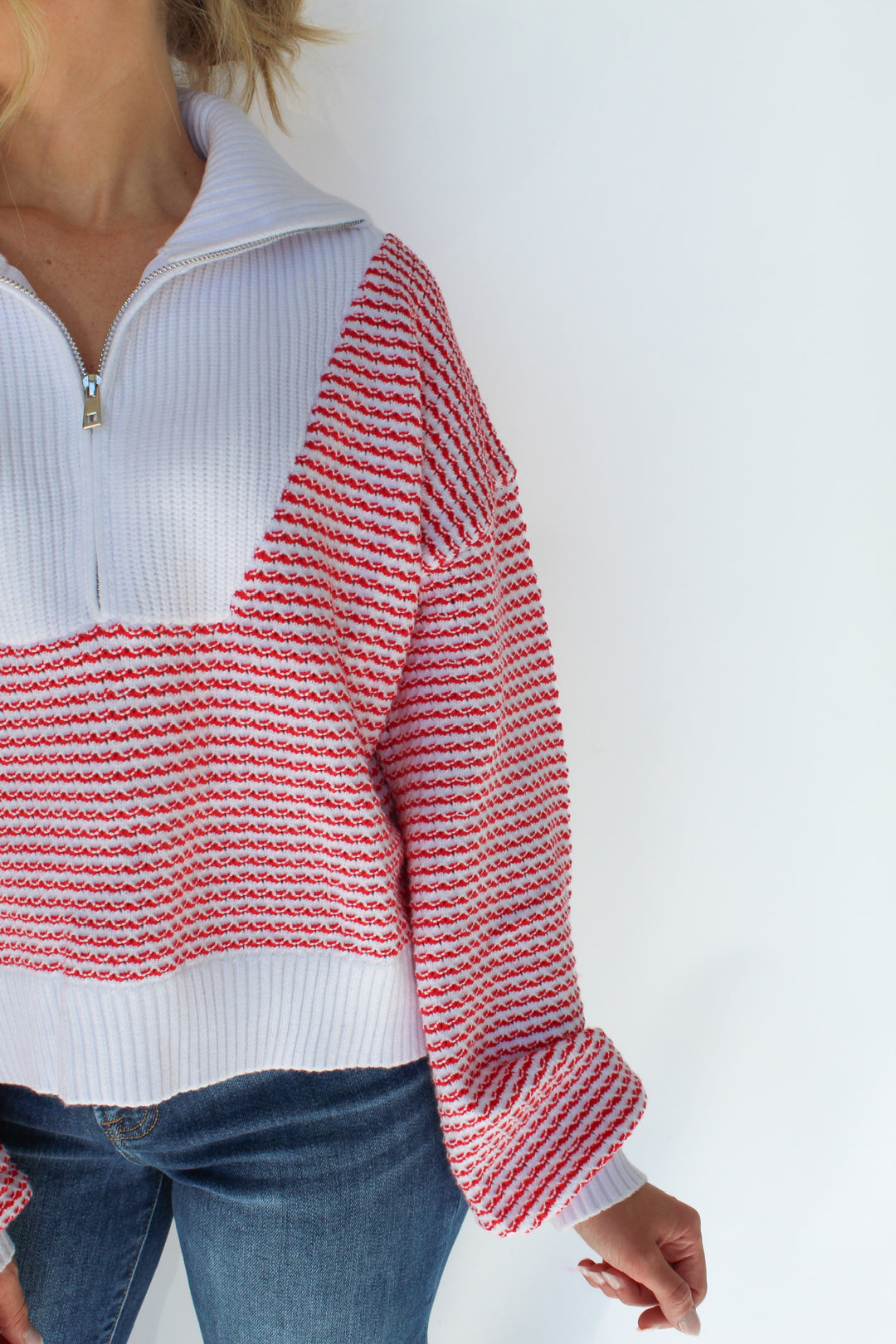 A FINE LINE STRIPED HALF ZIP SWEATER