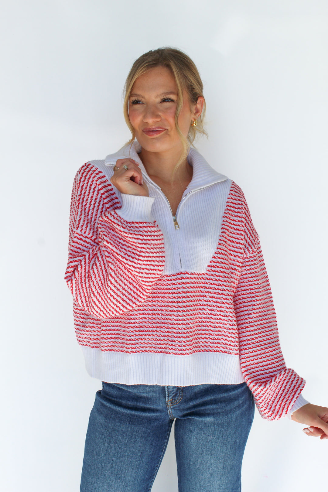 A FINE LINE STRIPED HALF ZIP SWEATER