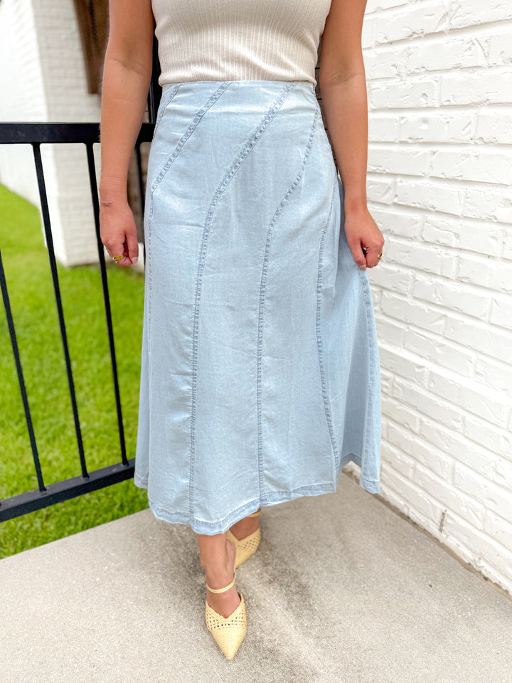 THE SCULPTED DIAGONAL DENIM MIDI SKIRT