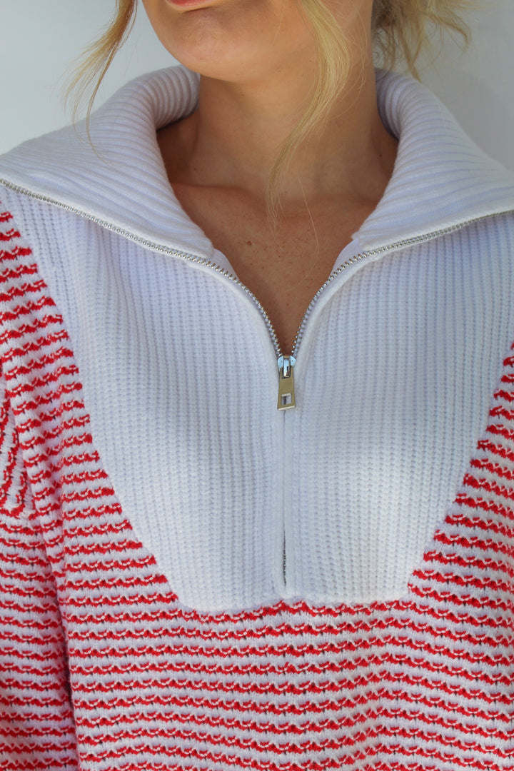 A FINE LINE STRIPED HALF ZIP SWEATER