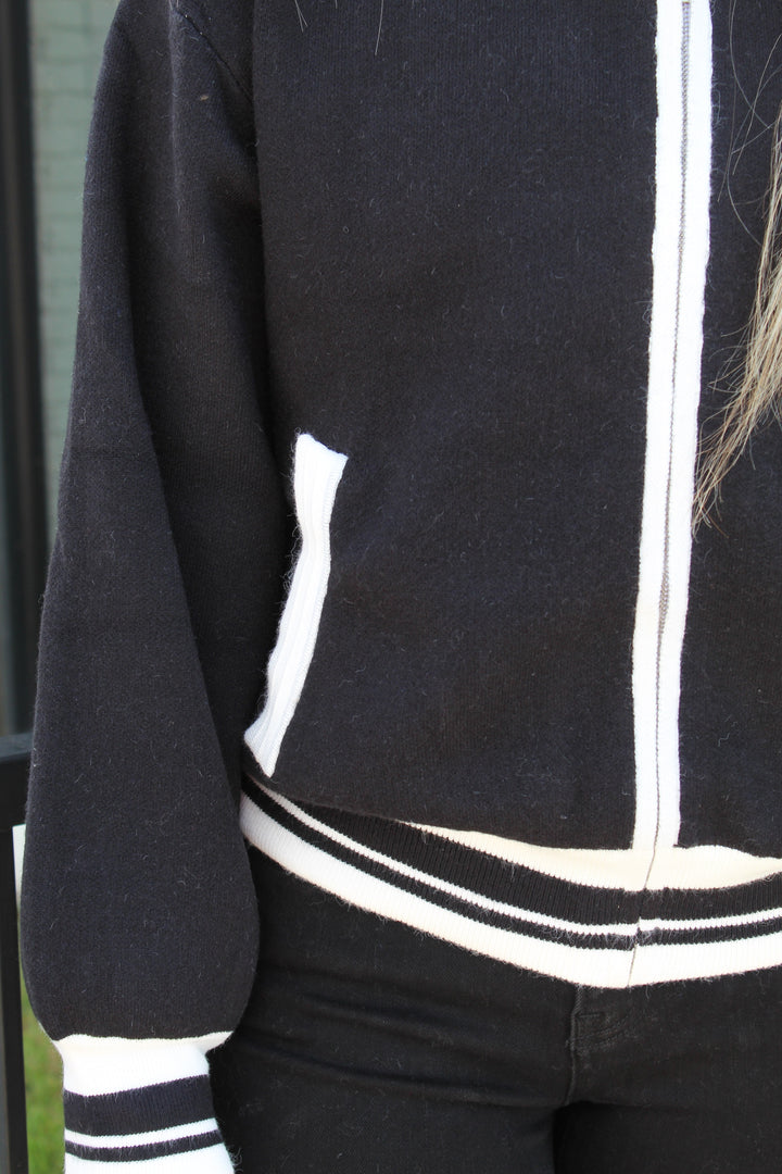 THE HERITAGE COLLARED ZIP UP SWEATER
