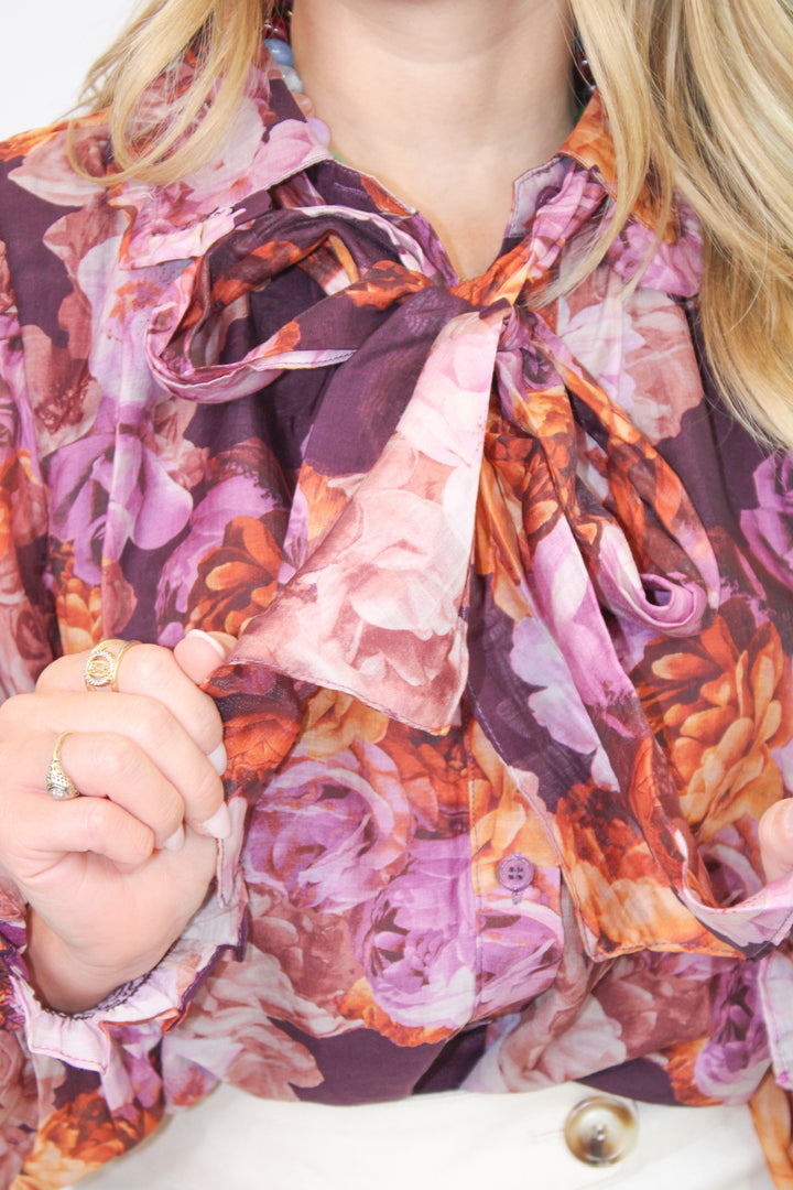 ALL TIED UP PURPLE FLORAL BLOUSE
