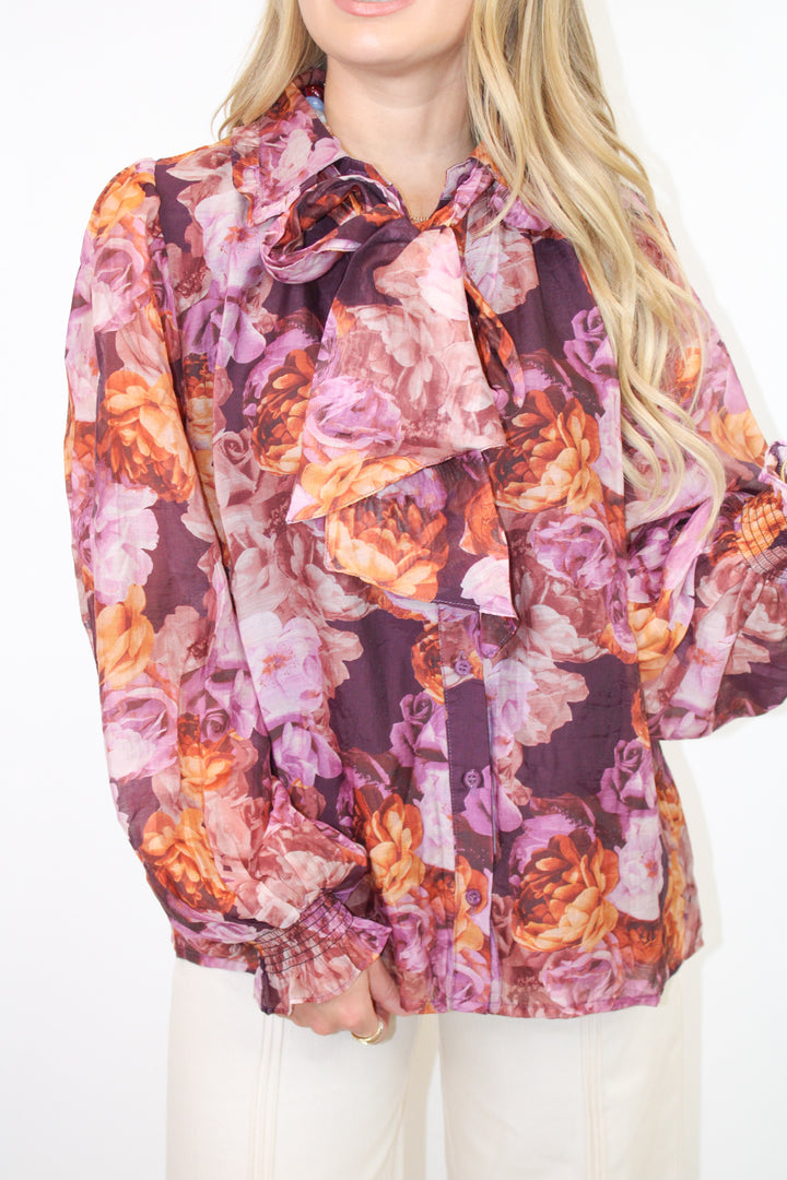 ALL TIED UP PURPLE FLORAL BLOUSE